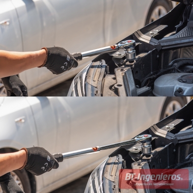 Detalle de uso real de la carraca telescópica en taller mecánico