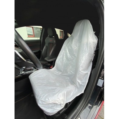 Funda protectora desechable instalada en asiento de coche.