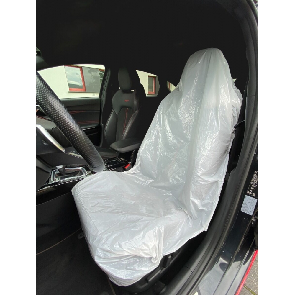 Funda protectora desechable instalada en asiento de coche.